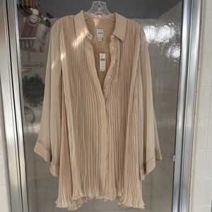 Maeve oatmeal color wide sleeve dress from Anthropologie.